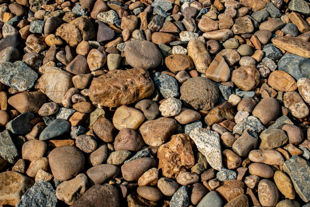 A detailed view of diverse river stones in Sambalpur, Odisha, India. Perfect natural texture background.